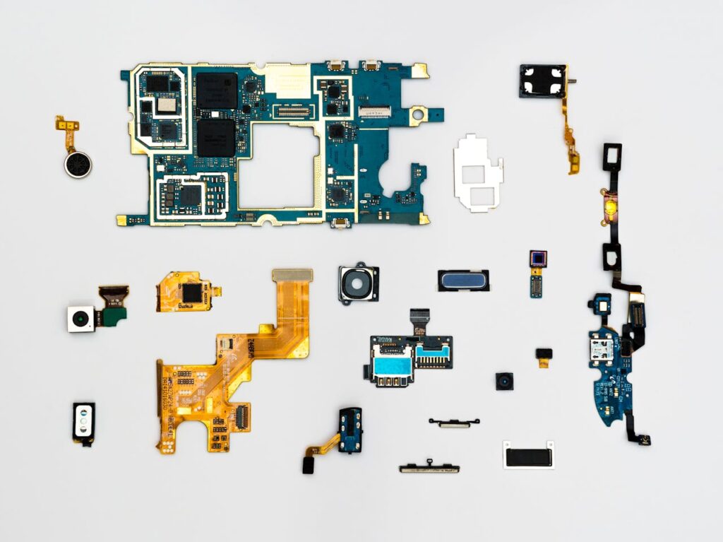 pexels-photo-1476321-1 Exploded view of smartphone components showcasing intricate technological design.