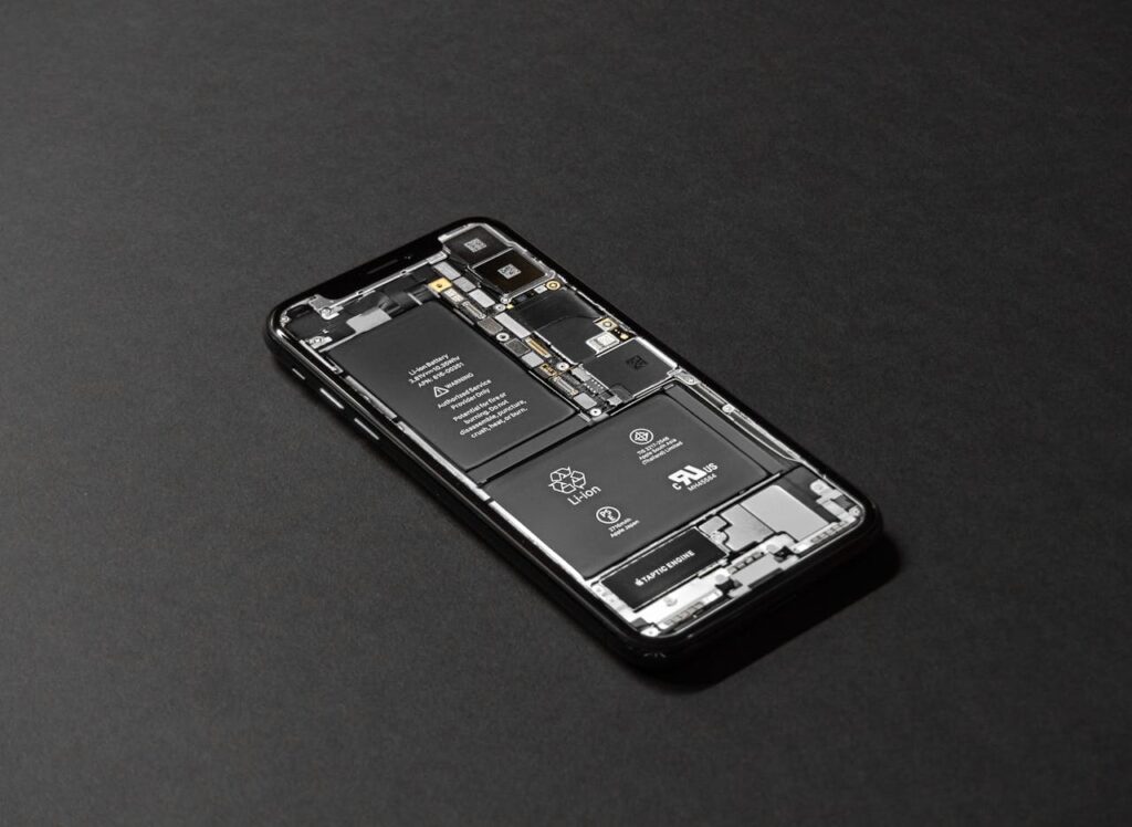 pexels-photo-719399-1 High-resolution image of a smartphone showcasing its internal components on a dark surface.